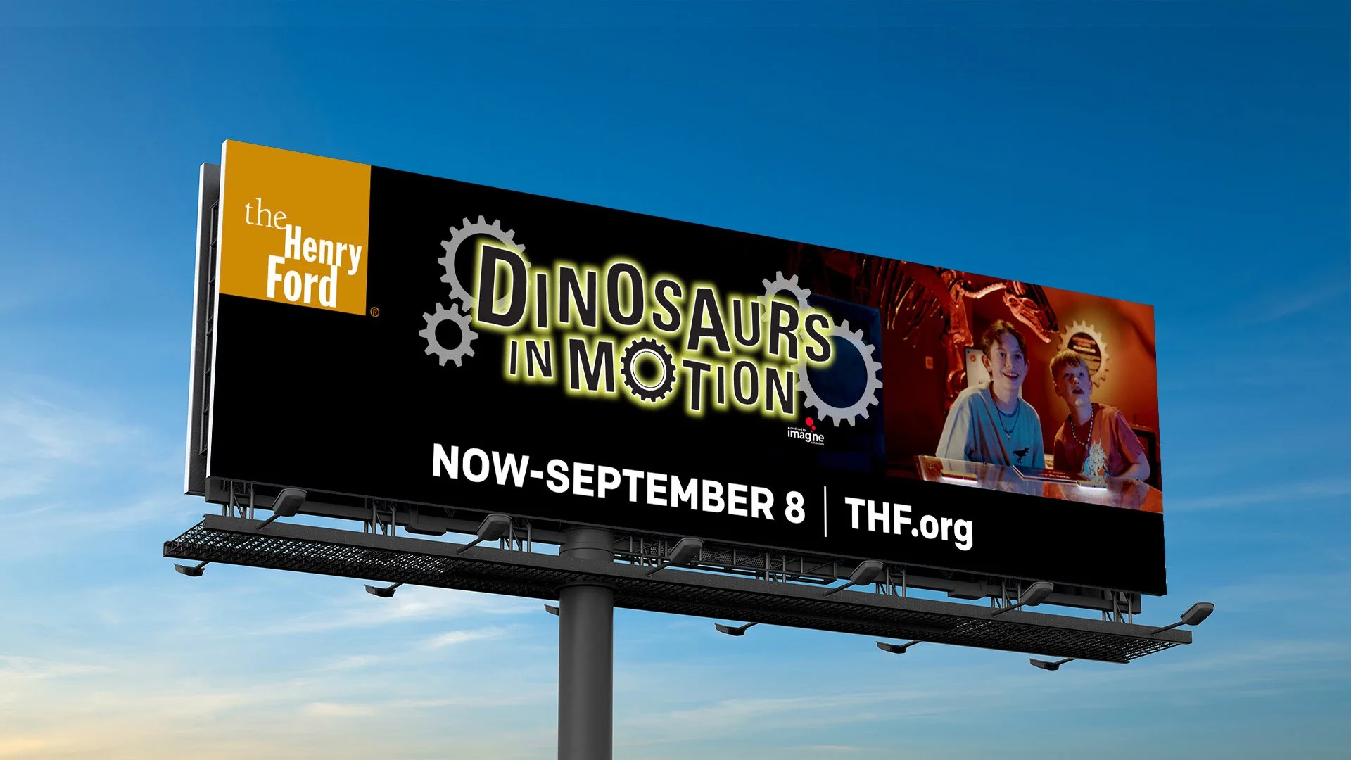 A Henry Ford Museum billboard for the Dinosaurs in Motion featured event.