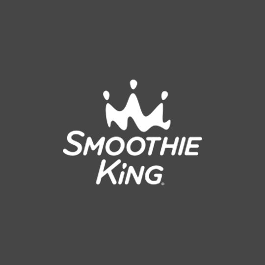 Smoothie King logo with a white crown above the brand name on a dark gray background