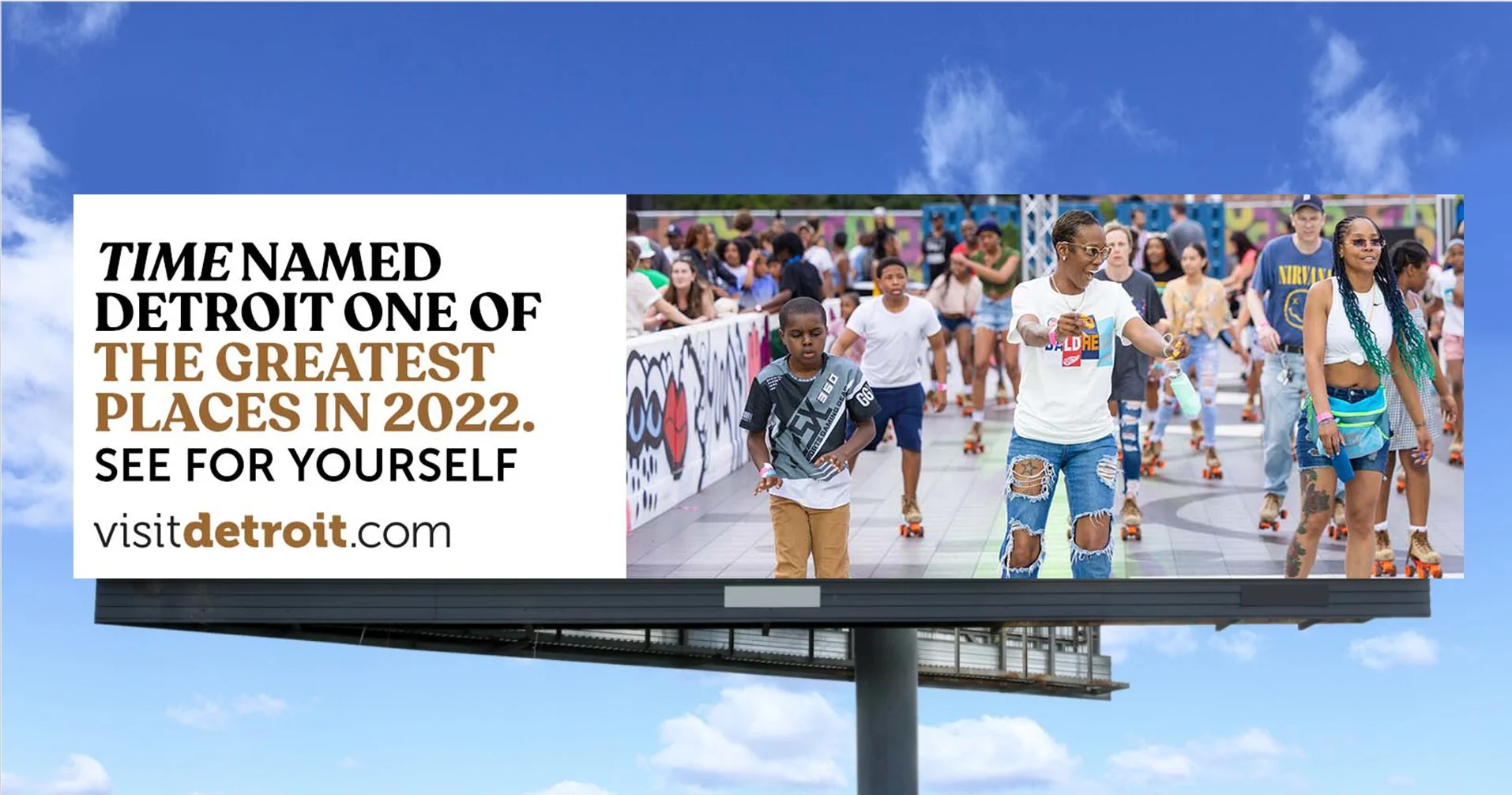 A Visit Detroit billboard. The headline reads, "TIME named Detroit one of the greatest places in 2022. See for yourself. visitdetroit.com"