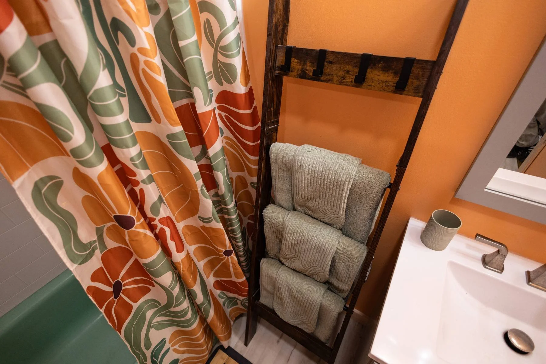Spacious shared bathhouse bathroom (one of two shared bathrooms a few steps away from your cabin) with heated floors, vintage ceramic tubs, and well stocked with towels.