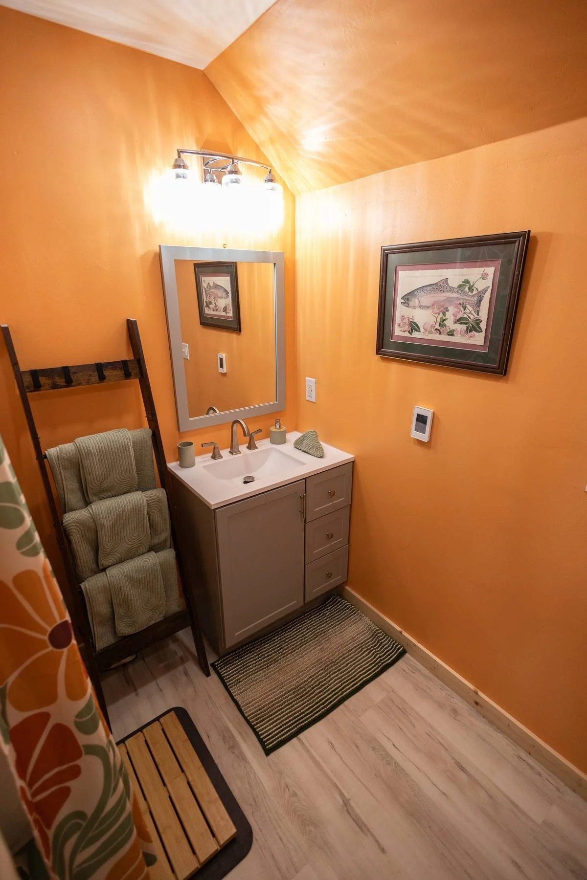 Spacious shared bathhouse bathroom (one of two shared bathrooms a few steps away from your cabin) with heated floors, vintage ceramic tubs, and well stocked with towels.
