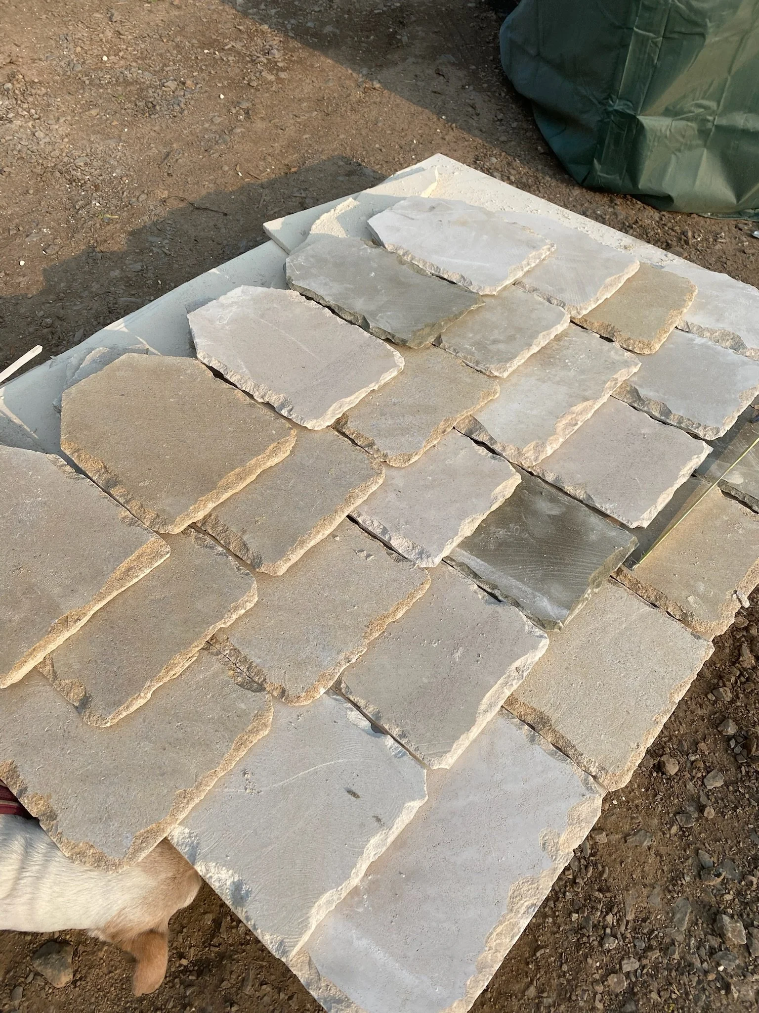 lime stone roof slates laid out on the ground