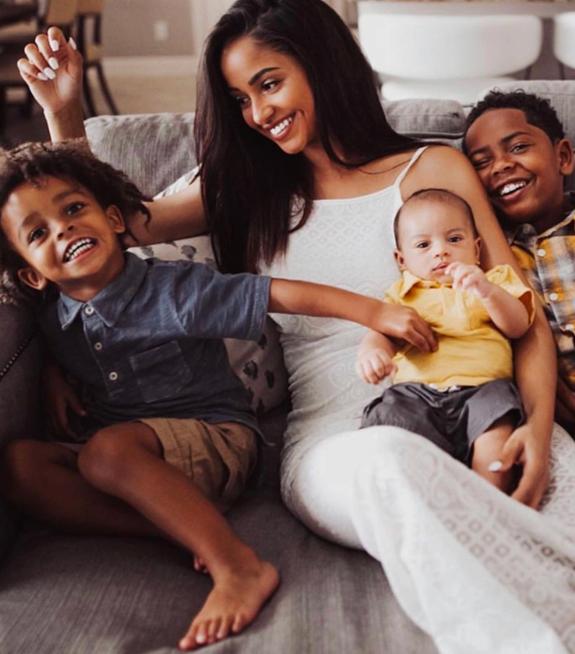 Mother and children at home, reflecting the family resource support provided by La Familia Family Services in Newport News, VA