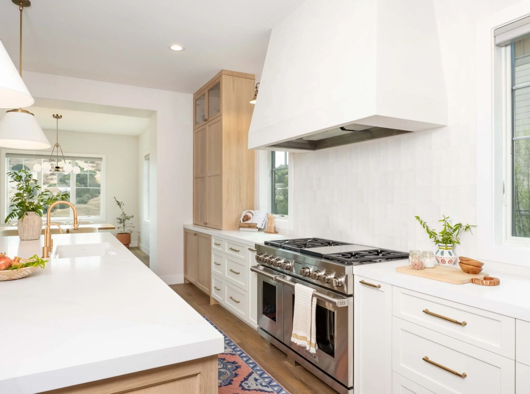 plaster range hood and white cabinetry