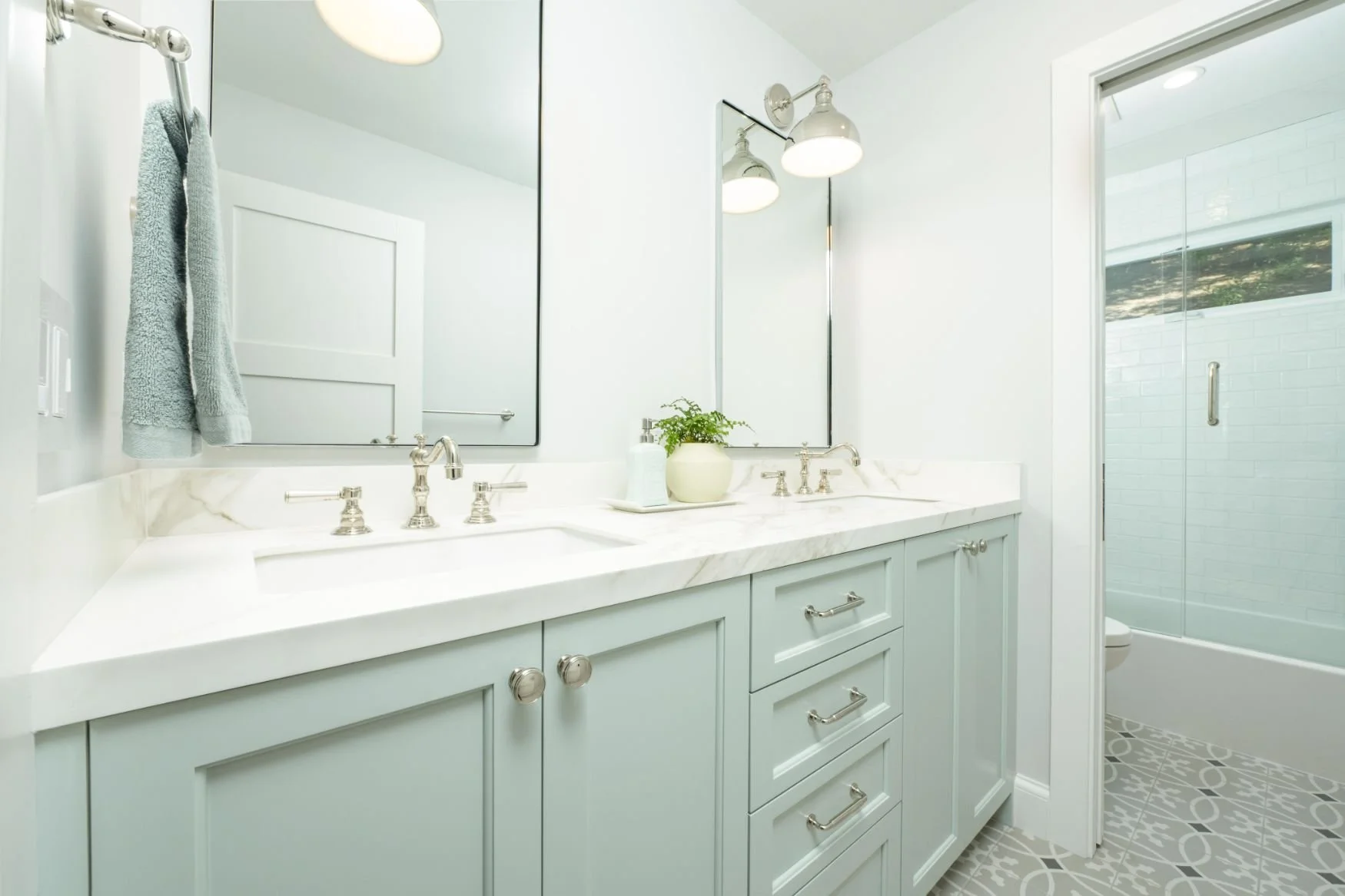 Mint and white bathroom with pattern tile