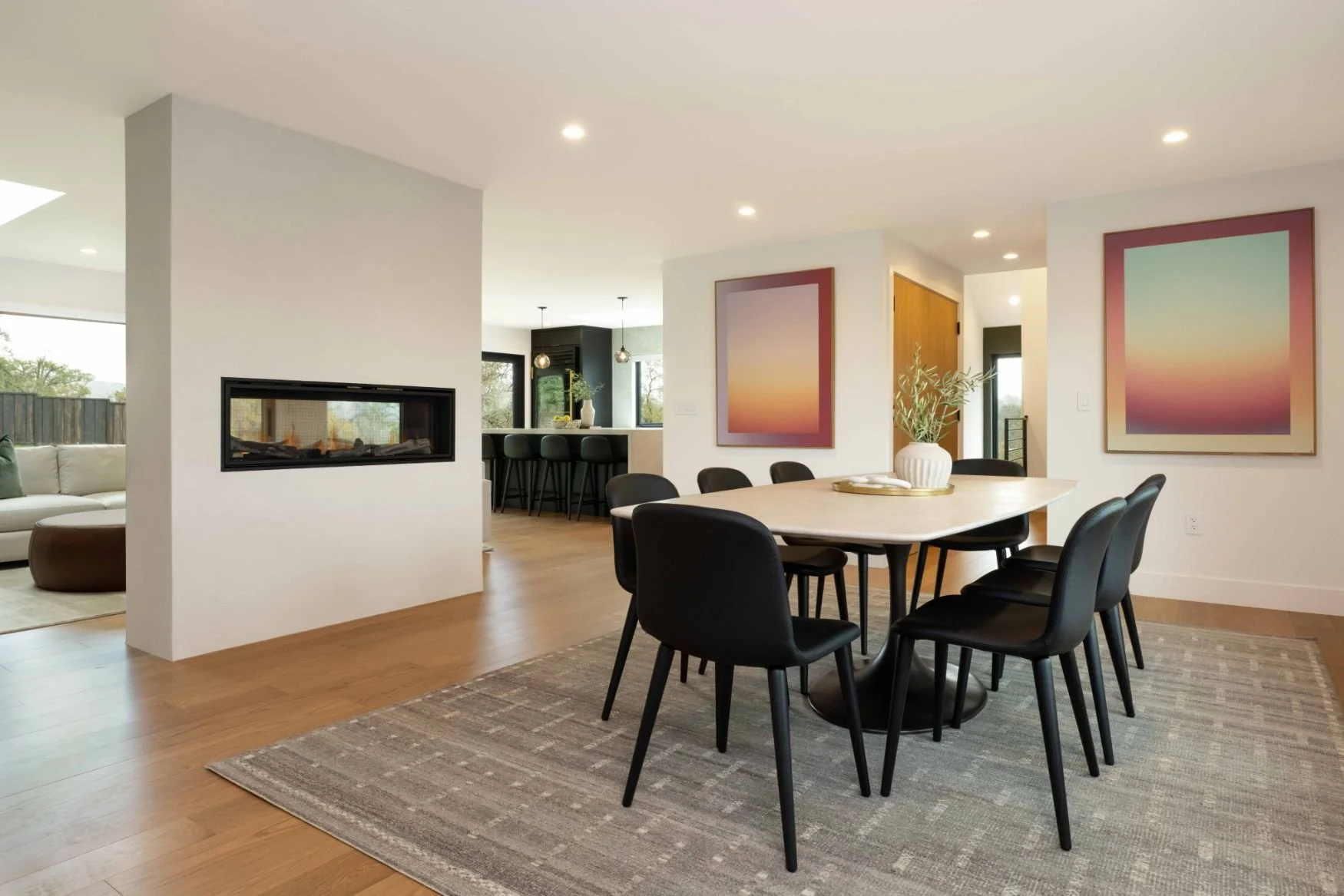 great room with see through fireplace and oak flooring