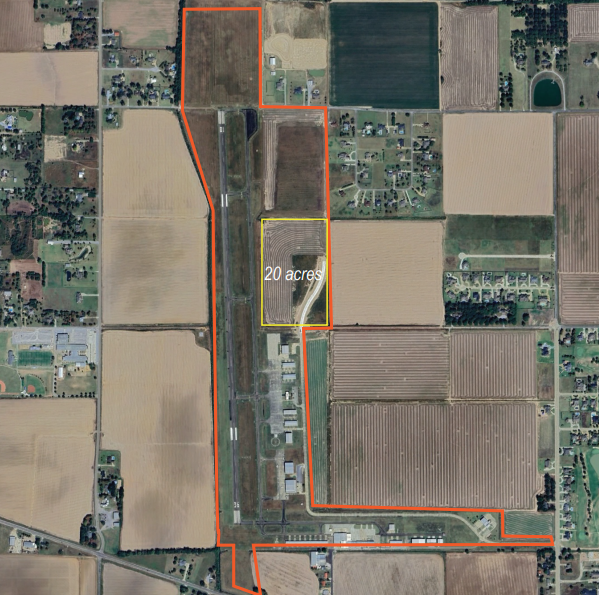 Aerial view of farmland with outlined property divisions, including a 20-acre area in the center.