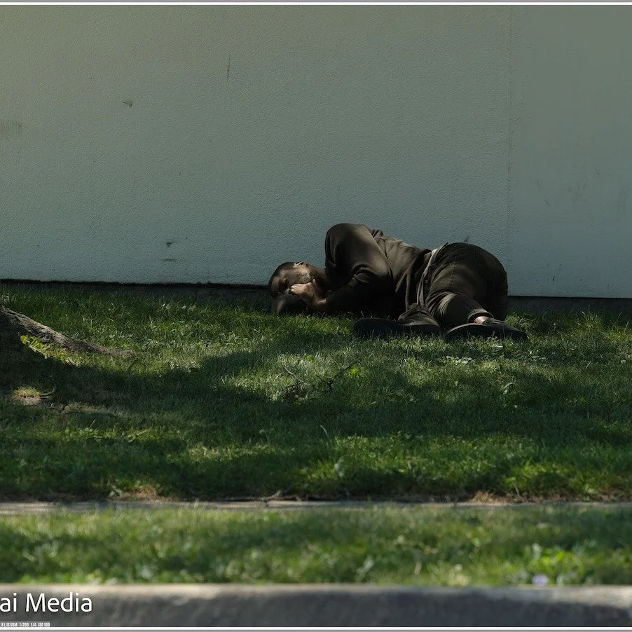 Either a homeless man or just an individual sleep outdoors