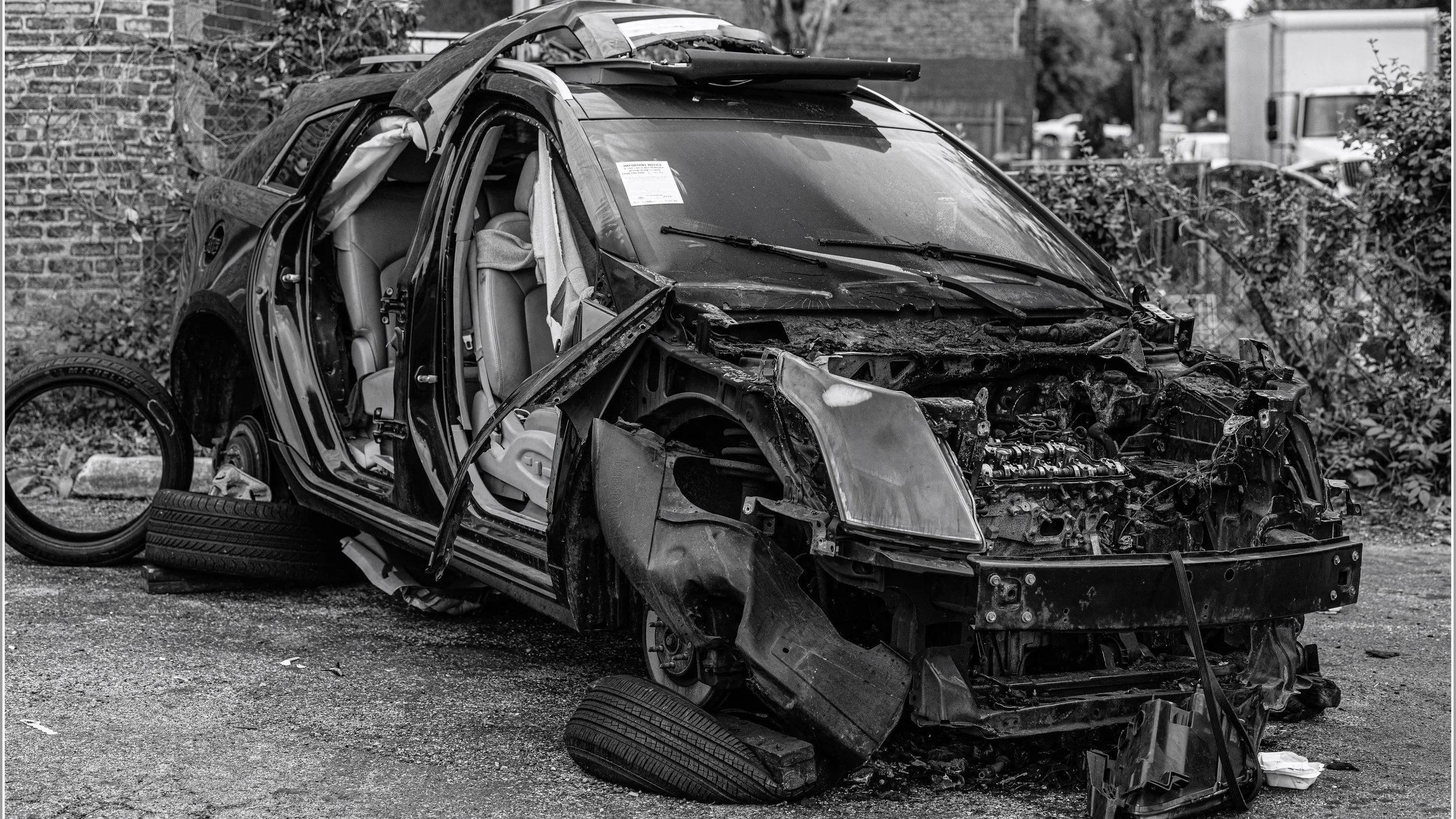 This is a 2012 Cadillac. Not sure of the model. The front of the vehicle was destroyed by fire. The interior is being used as a shelter.