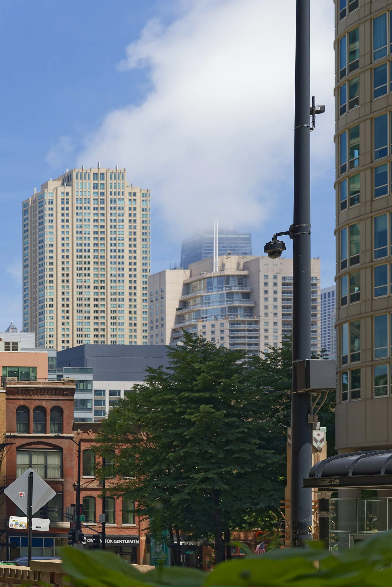 The upper floors of the 100-story John Hancock Center are hidden by low-hanging clouds. Located in the Magnificent Mile district and is currently the fifth-tallest building in Chicago. 