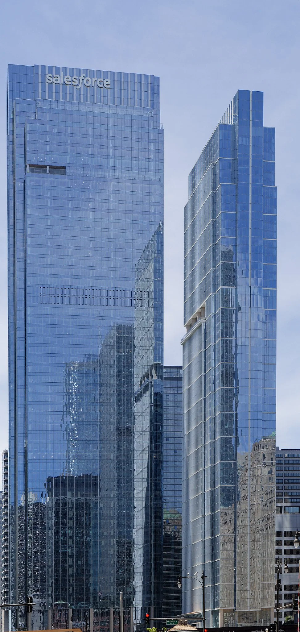 The glass on the Salesforce building is polished like a mirror.  The glass is reflecting images of the buildings nearby
