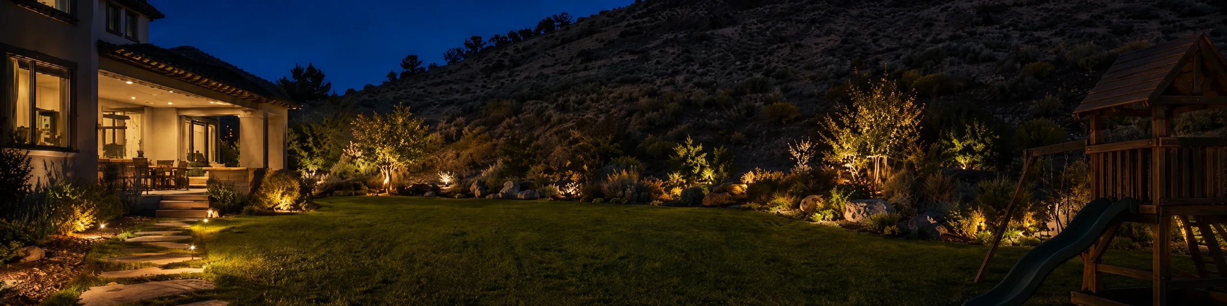 Lit backyard by hills