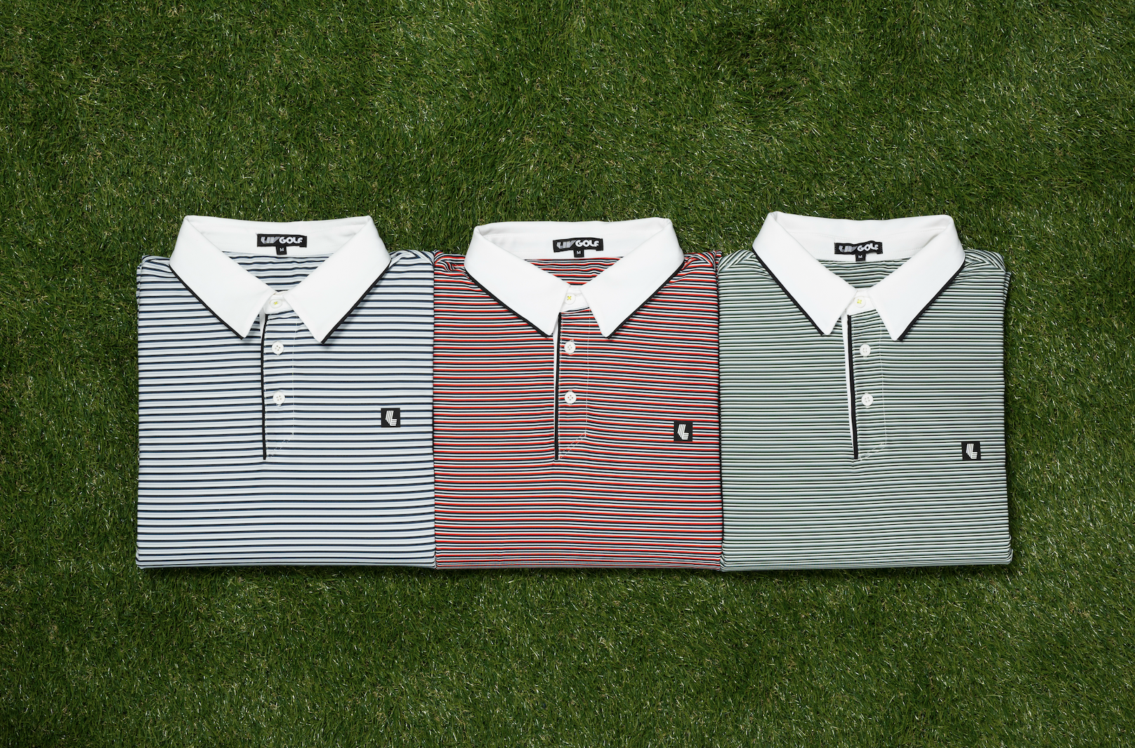 Three folded golf polo shirts with striped patterns in blue, red, and green, arranged on a grassy background, each with a white collar and a small logo.