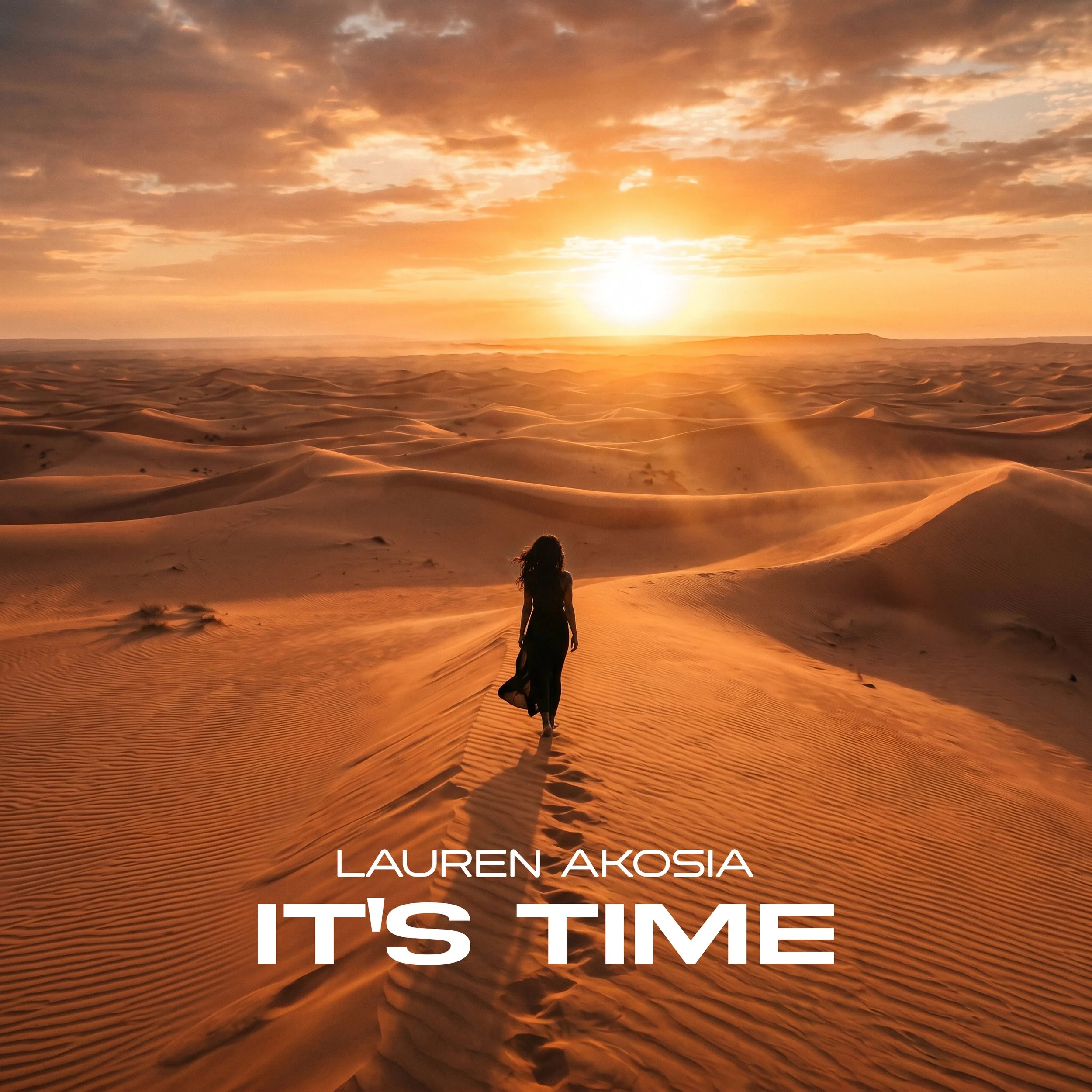 A woman walking alone through a desert landscape at sunset, with sand dunes extending into the horizon and a cloudy sky overhead. Text overlay reads "Lauren Akosia" and "It's Time."
