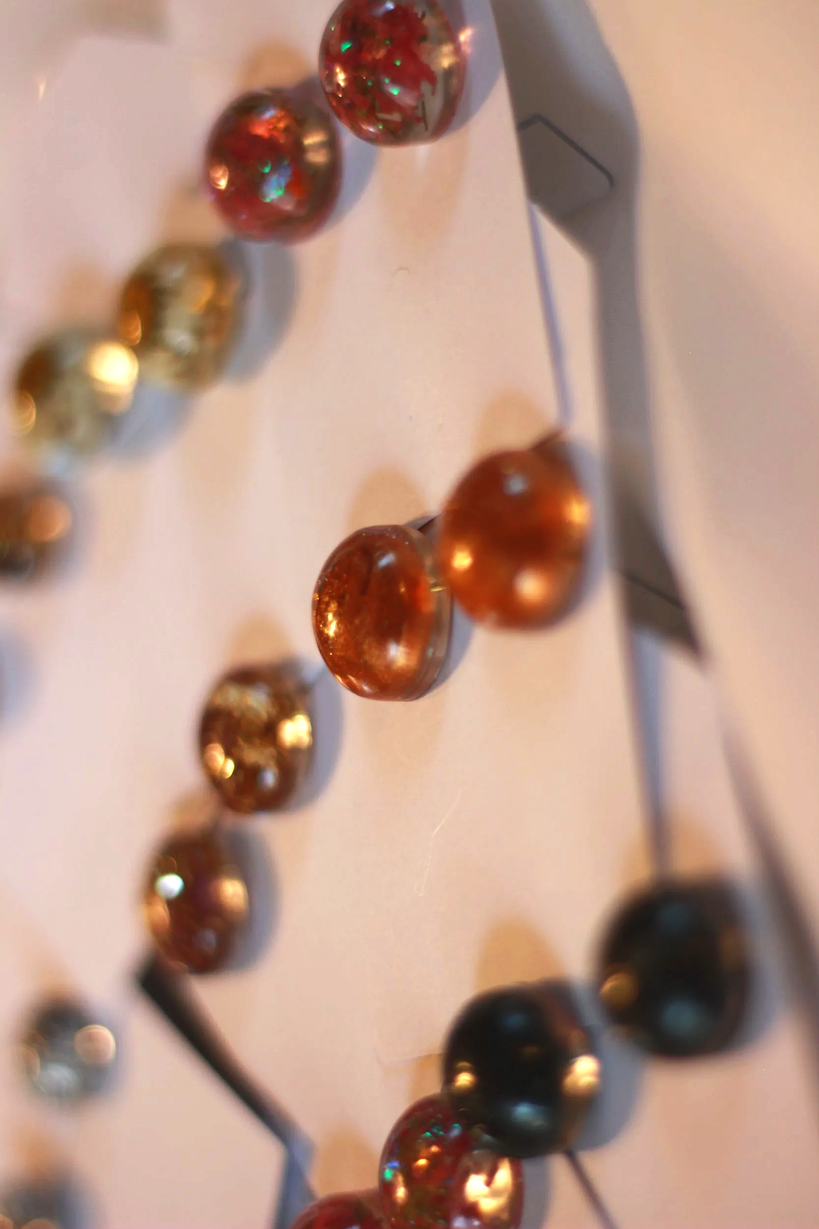 Close-up view of round resin studs in multiple colors