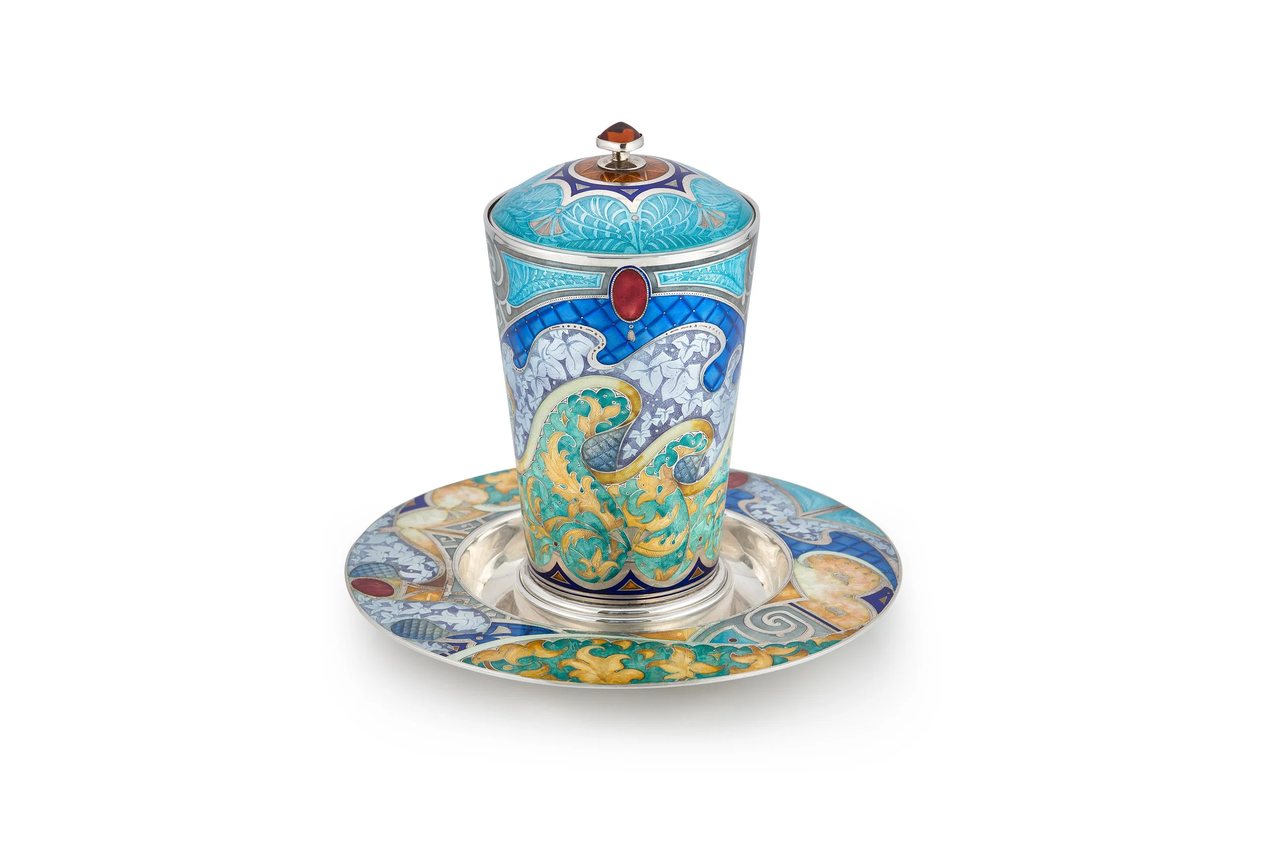 A ornate porcelain cup with intricate colorful patterns, placed on a matching saucer.