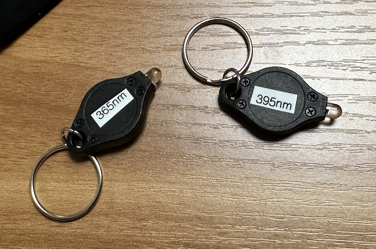 Two keychain UV flashlights, 395 nm and 365 nm.