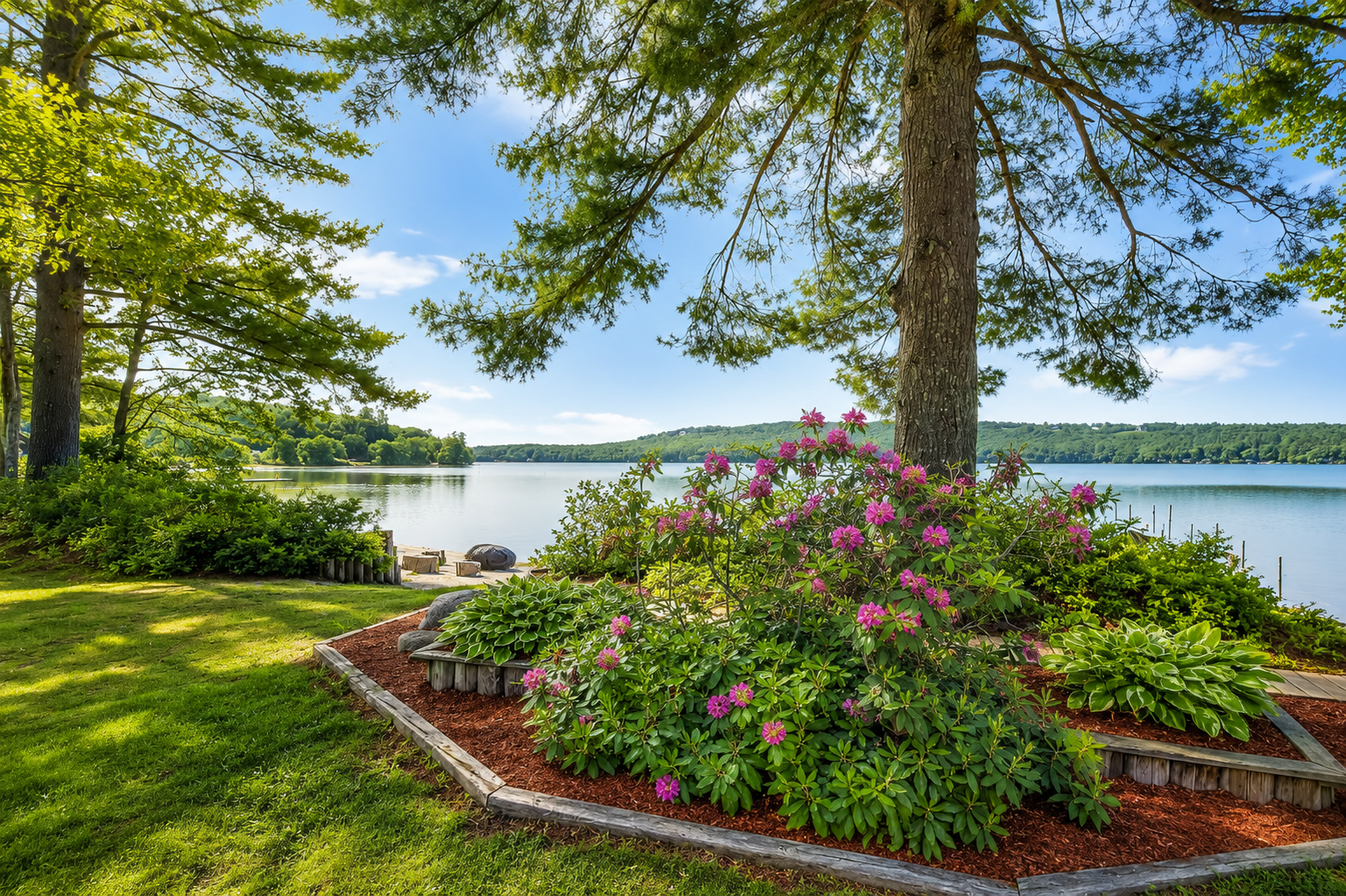 Spring lakeside retreat in Maine featuring blooming gardens, towering pine trees, and peaceful waterfront views.