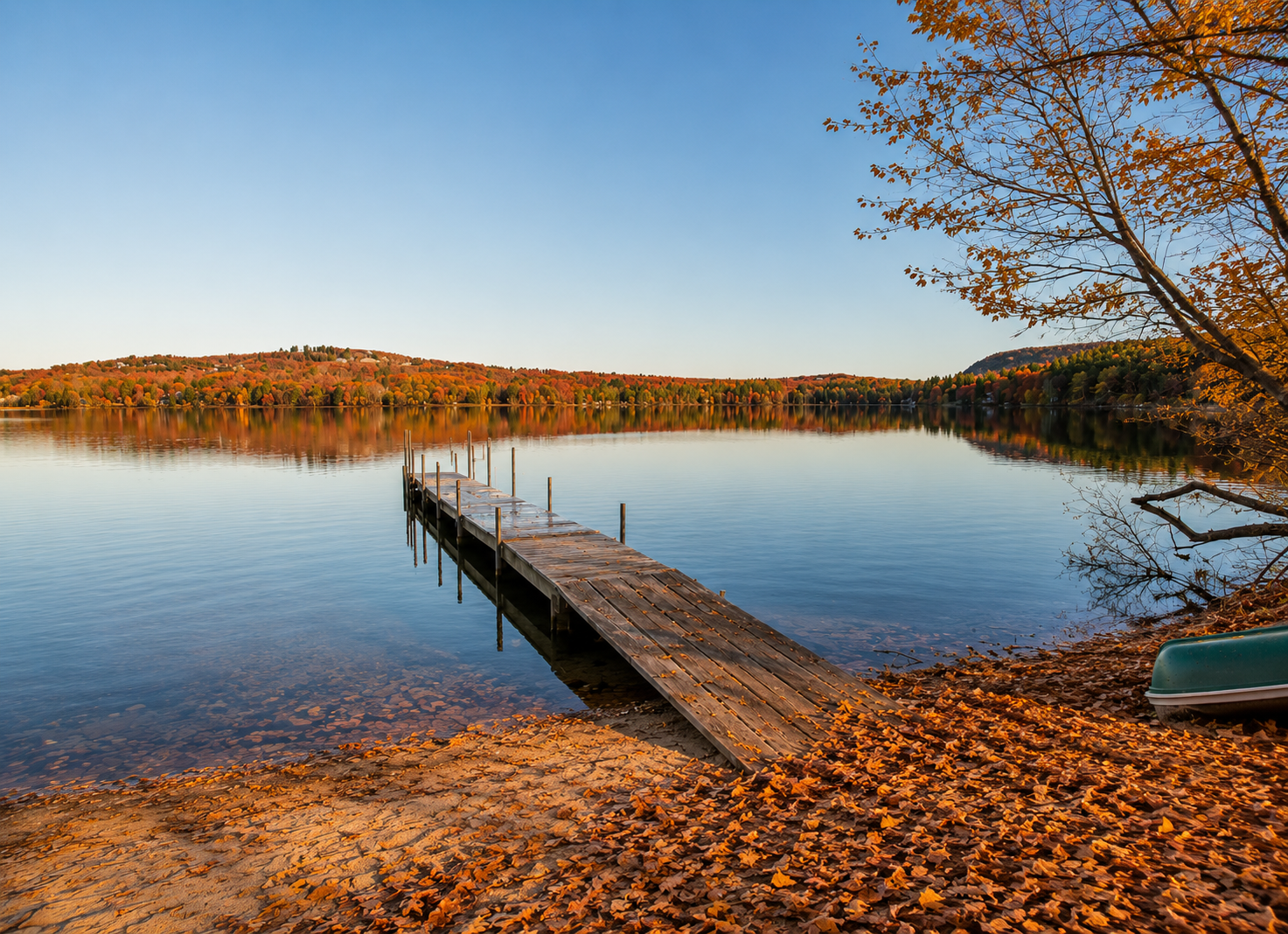 ibrant fall foliage surrounding a peaceful Maine lakeside retreat with colorful trees and scenic lake views.