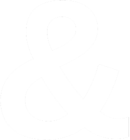 Close-up of a white ampersand symbol on a black background.