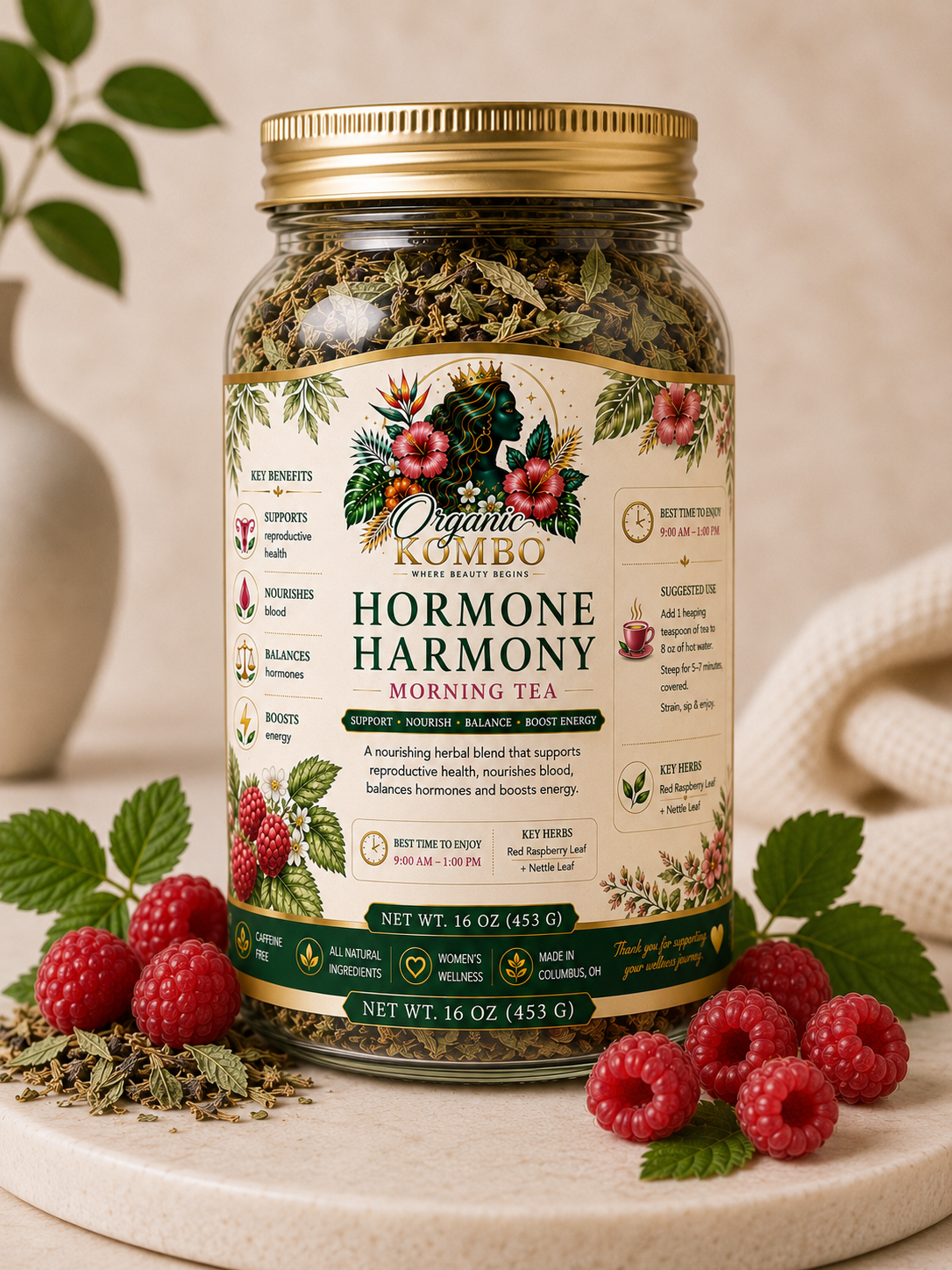 Organic Kombo Hormone Harmony Morning Tea loose leaf herbal tea in a 16 oz glass jar with red raspberry leaves, nettle leaf, and fresh raspberries.