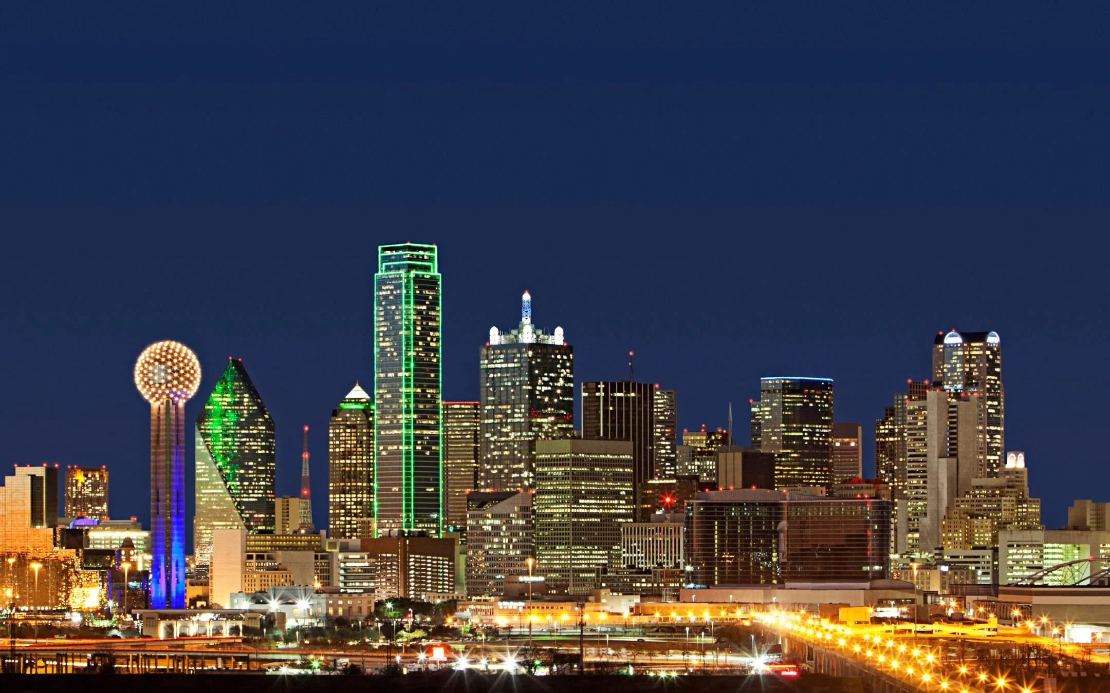 Dallas Texas skyline at night representing Melesh Construction Dallas, a certified accessibility renovation contractor serving the DFW Metroplex