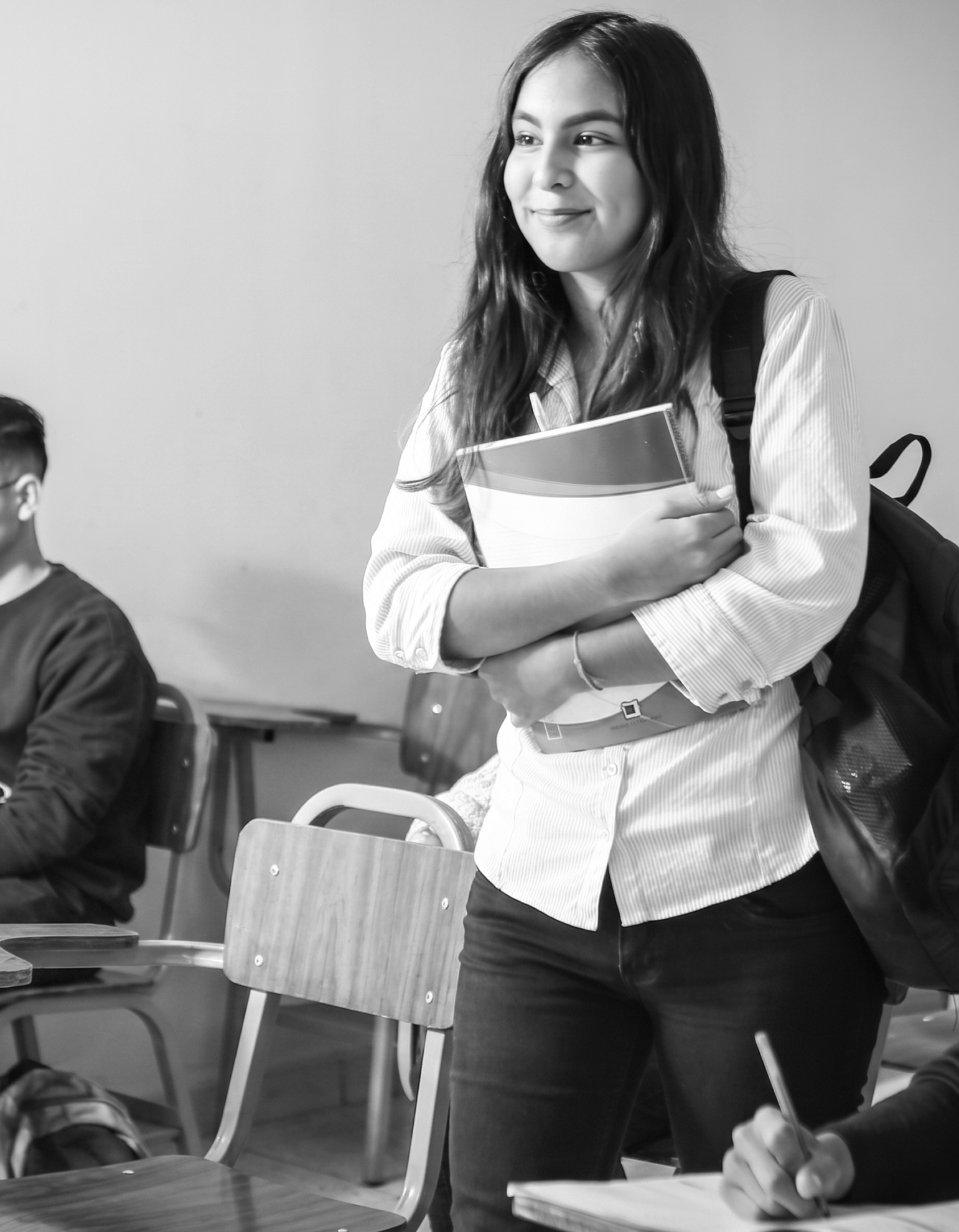 A representation of a potential young female student at Telos (college founded by Charlie Anastasi) carrying a backpack and standing in a classroom in Philadelphia