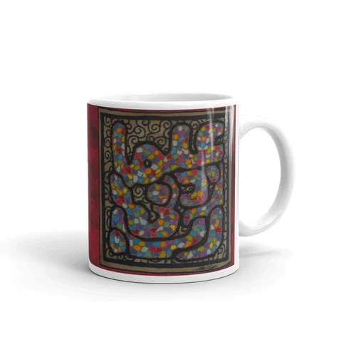 Coffee mug featuring a colorful abstract snake design with intricate black outlines.