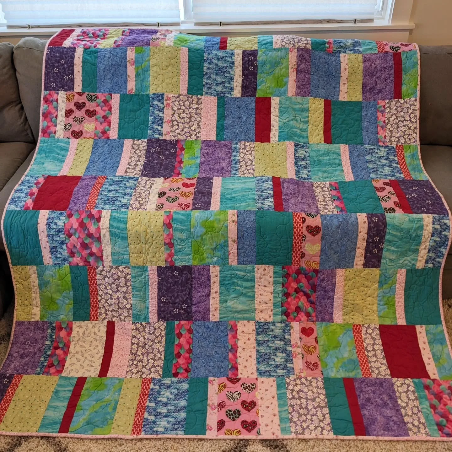 My client made a nightgown for her niece's birthday every year when she was little. She asked me to make a quilt out of the fabric scraps now that her niece is a teenager - and here's the result! 

This was a fun, scrappy, sentimental keepsake - one 