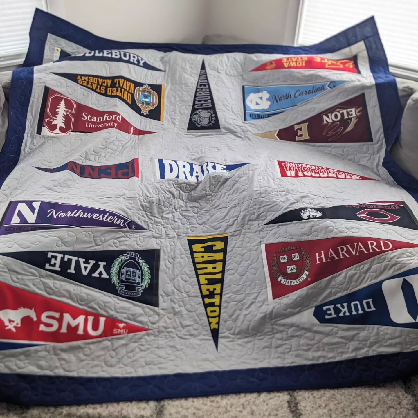 College pennant quilt for a proud grandpa. 🚩

Each flag represents a university one of his grandchildren has graduated from. This one was a unique project to design and quilt!

#quiltersofinstagram #quilting