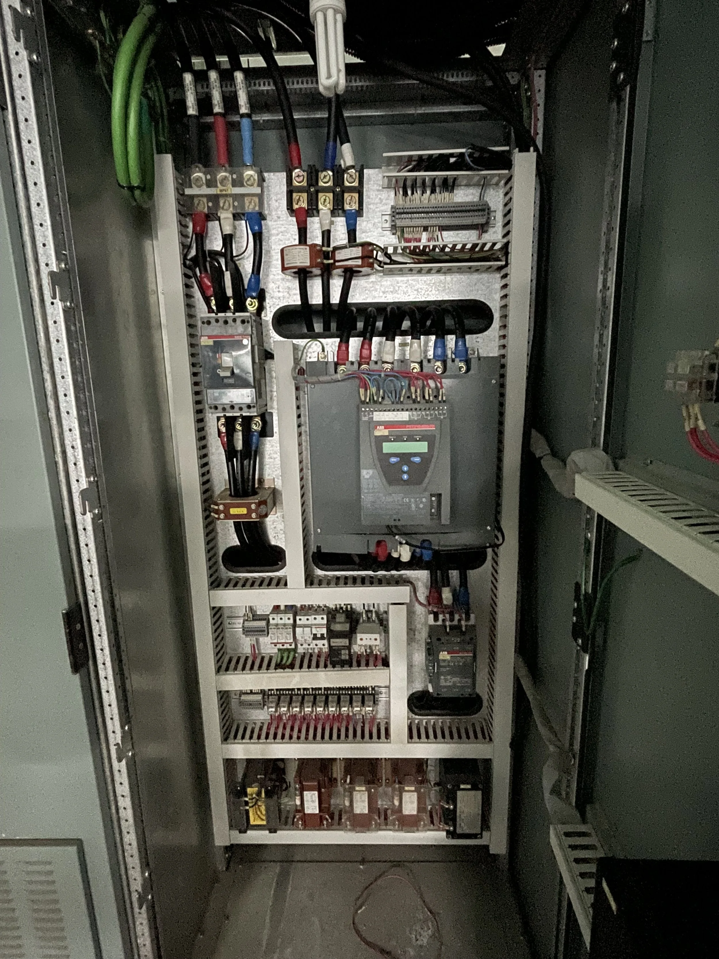 Clean and organized electrical motor control panel with Variable Frequency Drive (VFD).