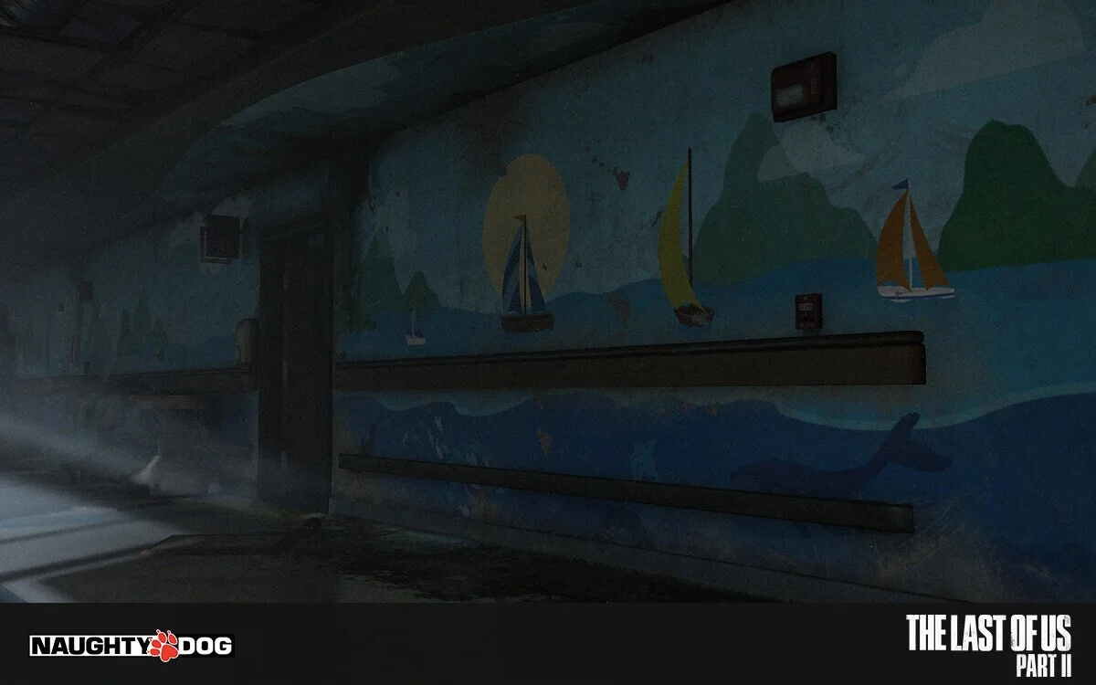 Dark wall mural in a tunnel with sailboats, mountains, and the sun painted on it.