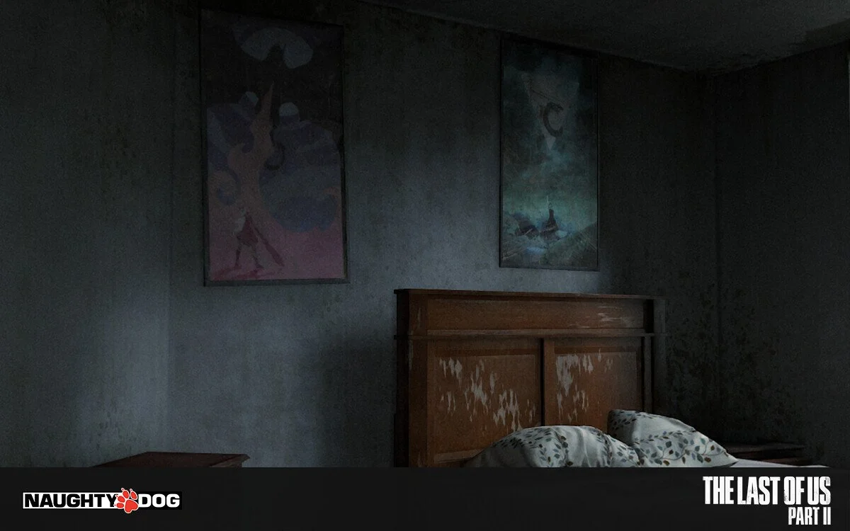 A dark bedroom with a wooden headboard, two pillows on the bed, and two framed posters on the wall, featuring characters from the video game 'The Last of Us Part II,' with a 'Naughty Dog' logo in the bottom left corner.