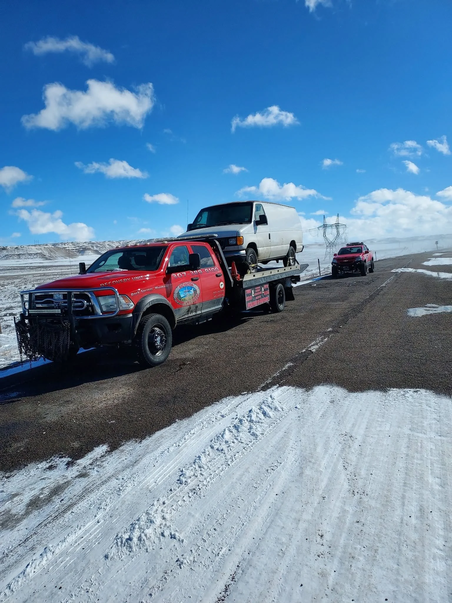 trucks with white van on deck