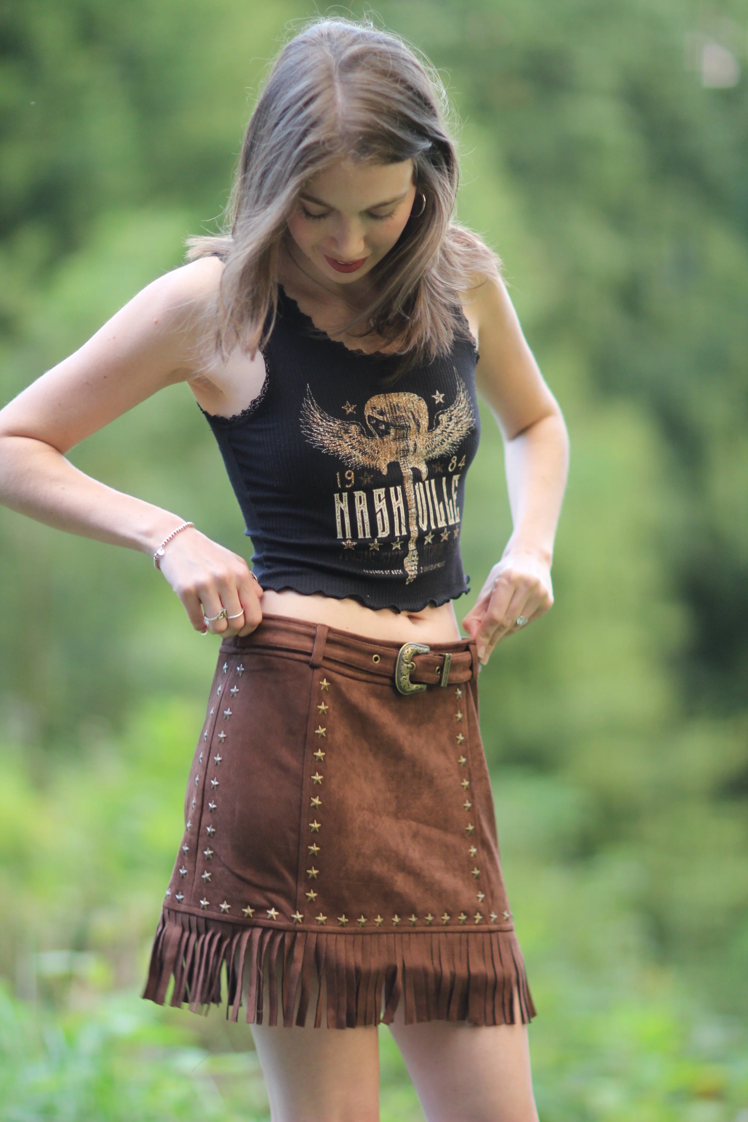 Woman dancing wearing the Nashville Nights Fringe Skirt showing the movement of the fringe