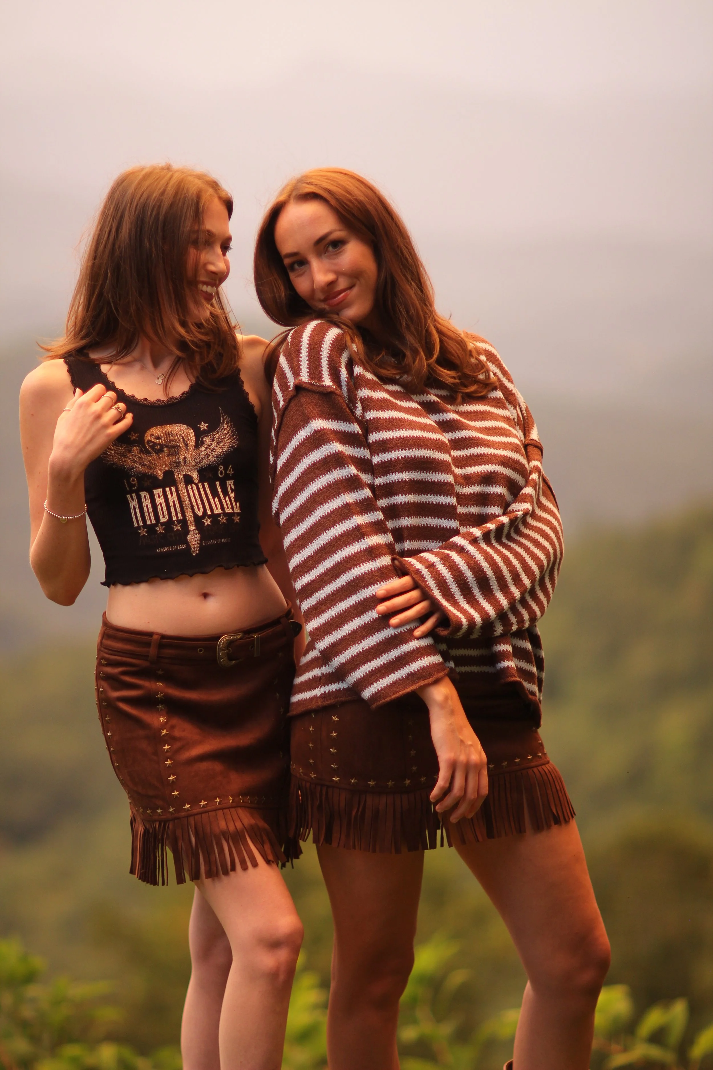 Close-up side view of the Fireside Stripe Sweater showing the brown and cream knit texture