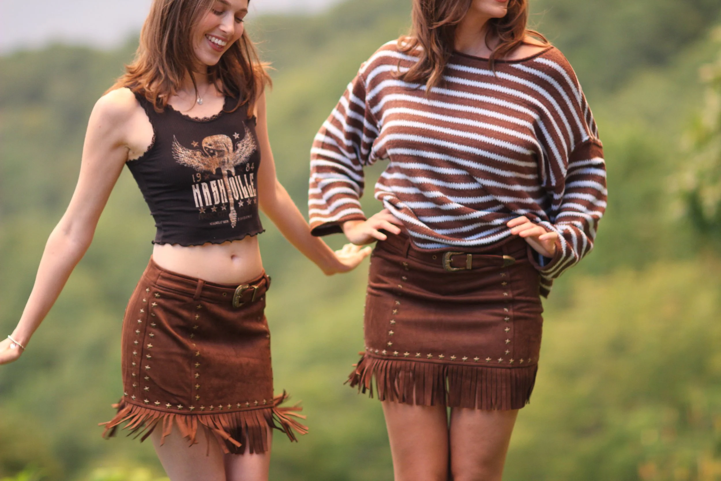 Close-up of the fringe hem and studding detail on the Nashville Nights Fringe Skirt