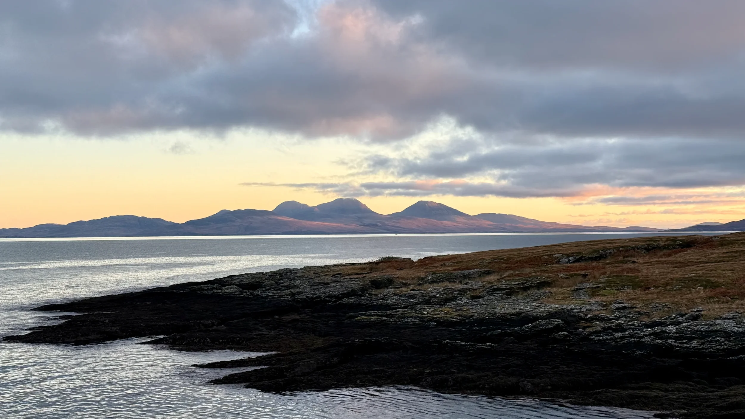 colonsay-coastal-sunset-mountain-view.webp
