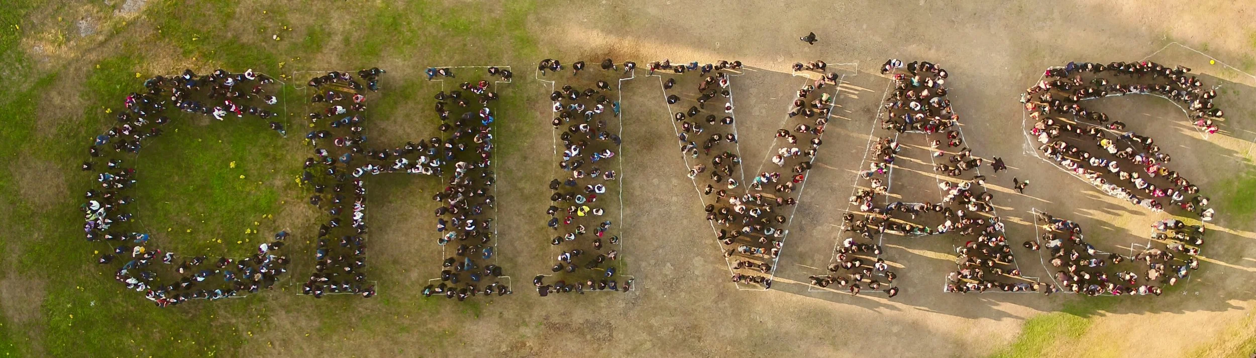 Aerial picture of the Chivas staff on a cultural visit to Scotland, 800 people in kilts spelling out CHIVAS.