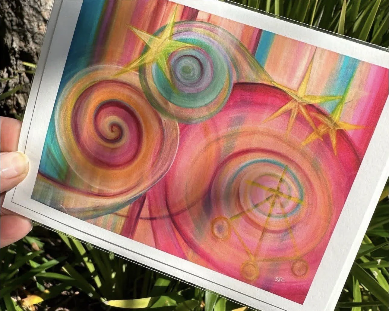 Colorful abstract painting with spiral patterns and star-like shapes in shades of pink, green, yellow, and blue.