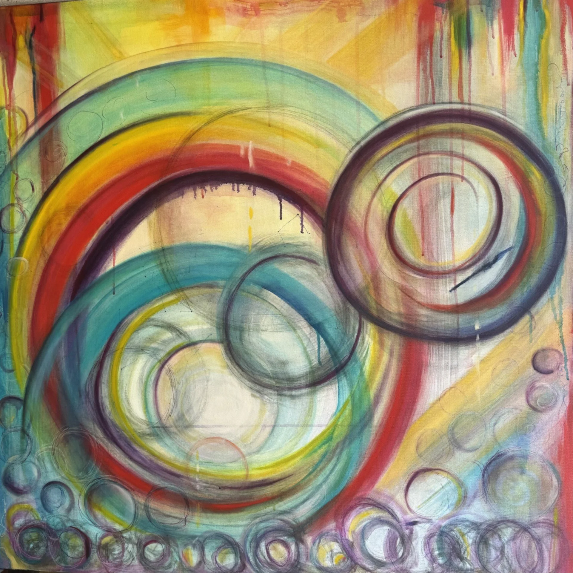Abstract colorful artwork featuring multiple concentric circles in rainbow colors on a yellow background.