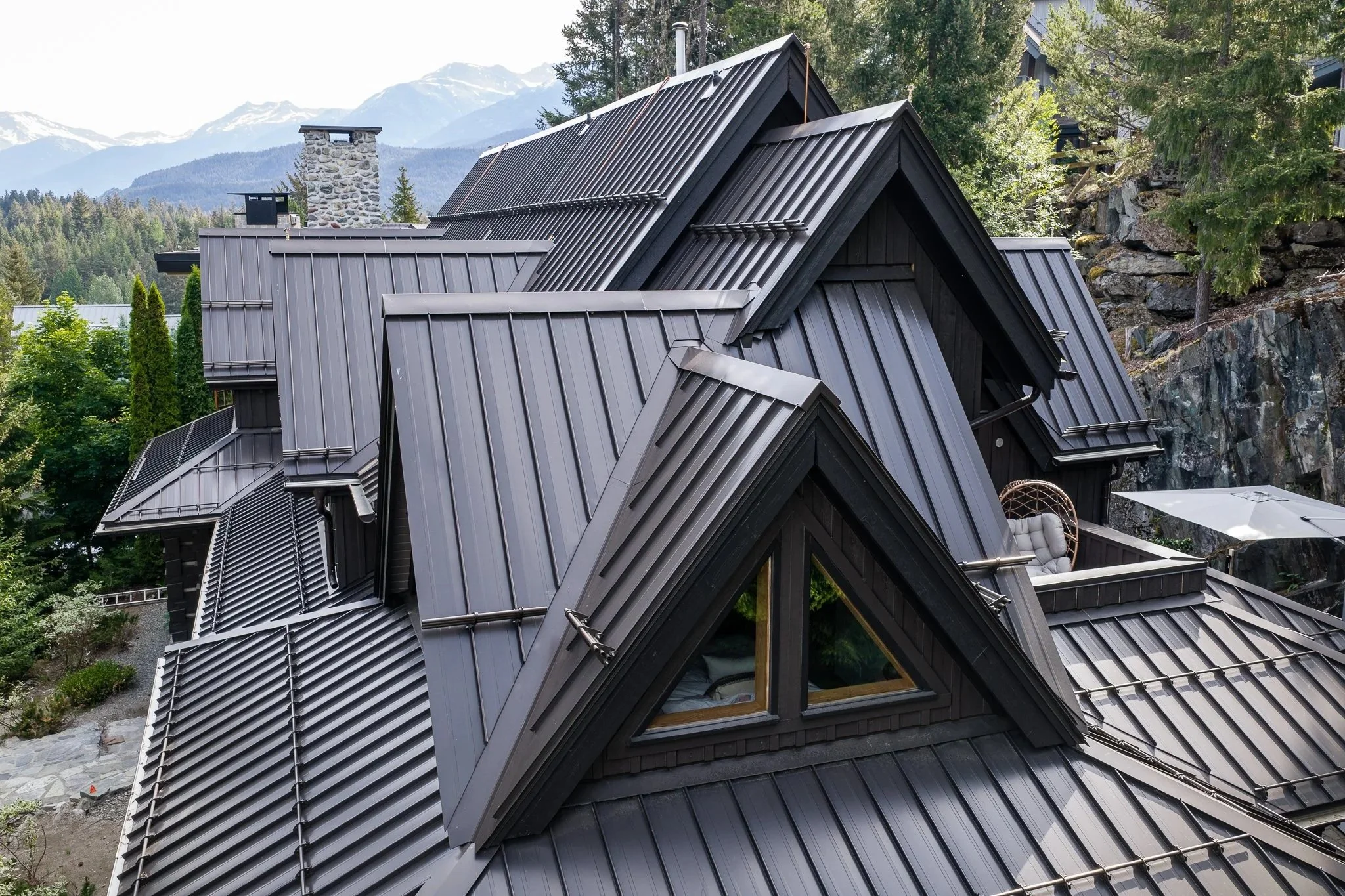Standing seam metal roof installed on a luxury home in Whistler, built for long-term performance in the Sea to Sky climate.