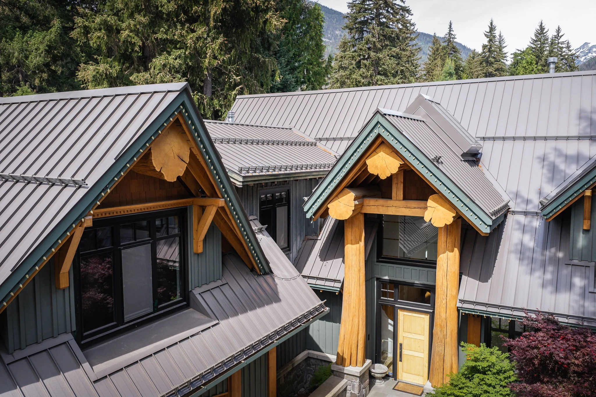 Luxury mountain home featuring standing seam metal roofing designed for long-term durability in the Sea to Sky climate.