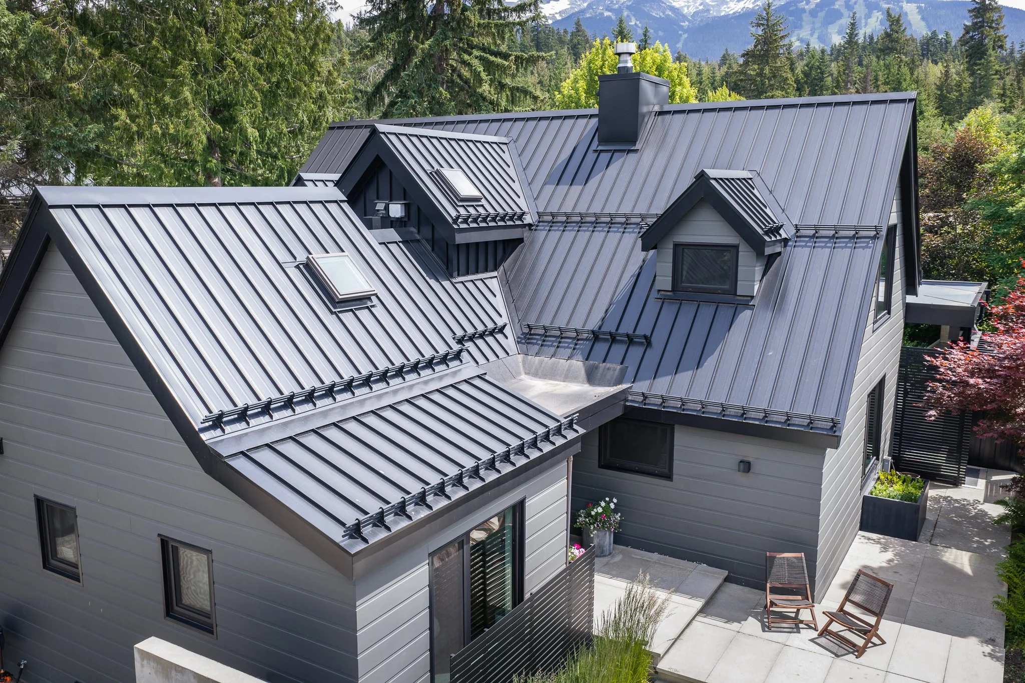 Standing seam metal roofing installed on a custom residence, showcasing precision craftsmanship and long-term durability.