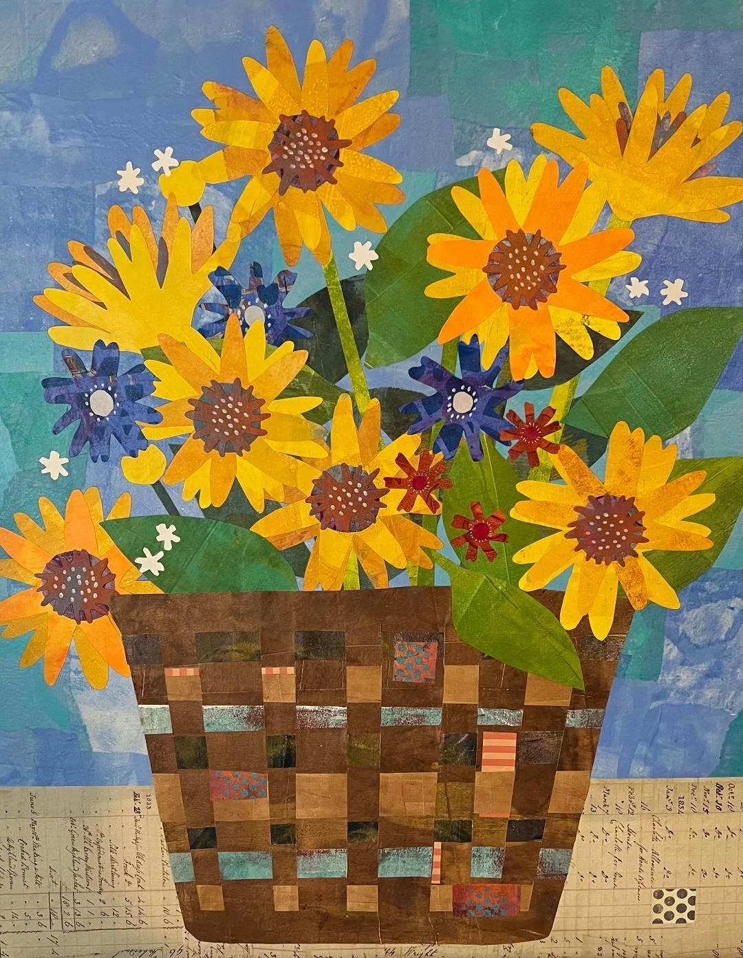 Collage of sunflowers in a basket on a textured blue background with scattered small white and red flowers.