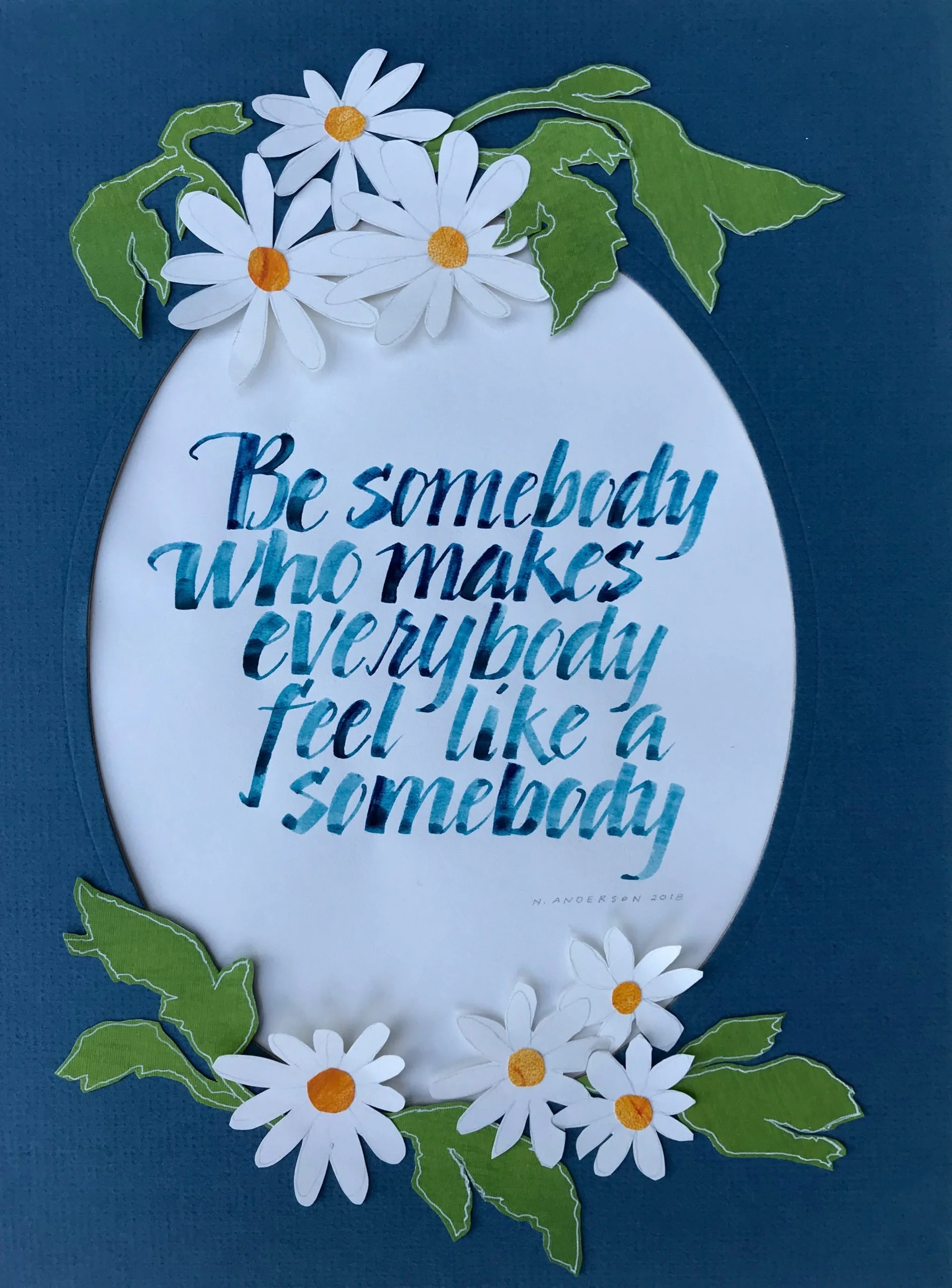 A decorative poster with a quote reading 'Be somebody who makes everybody feel like a somebody,' surrounded by paper daisies and green paper leaves, set against a blue background.