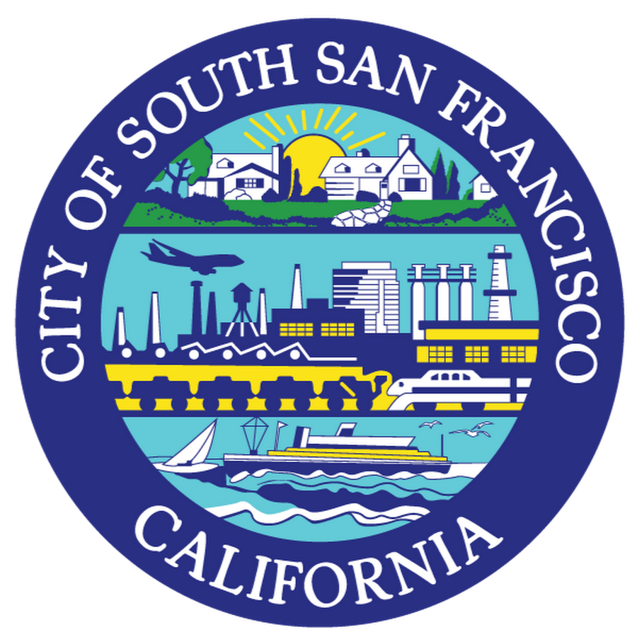 Seal of the City of South San Francisco, California, featuring a landscape with a sunrise, houses, trees, an airplane, industrial buildings, ships, and boats.