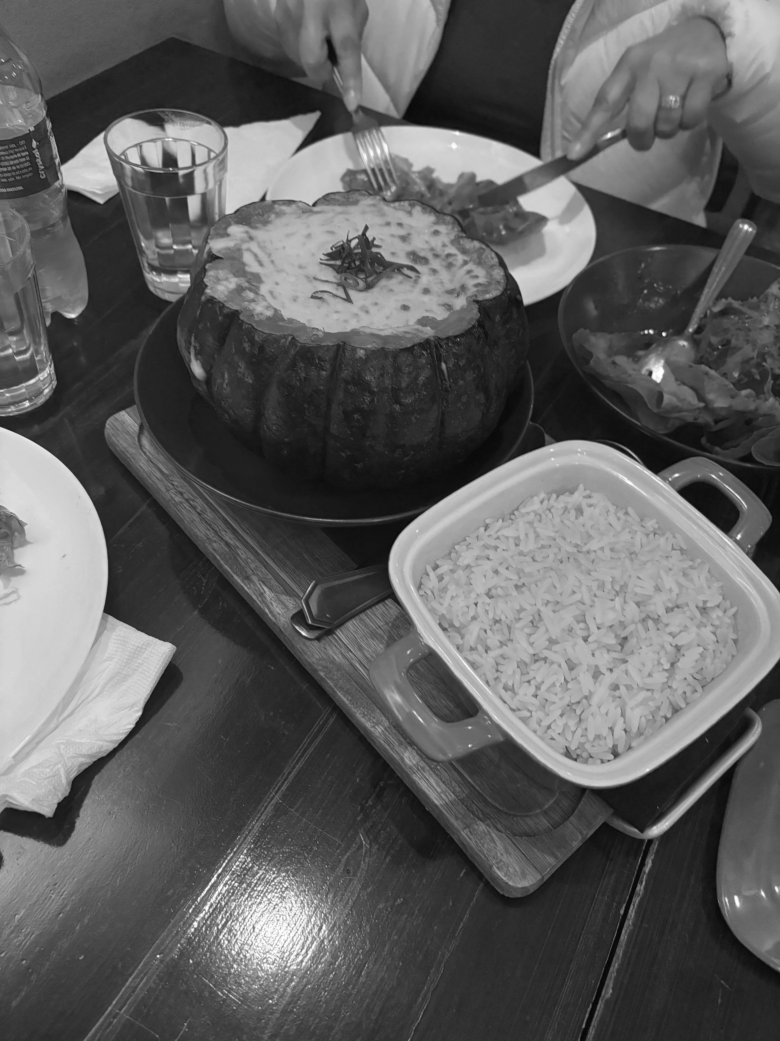 Spanish-inspired pumpkin filled with shrimp risotto and rice plate as creative design inspiration