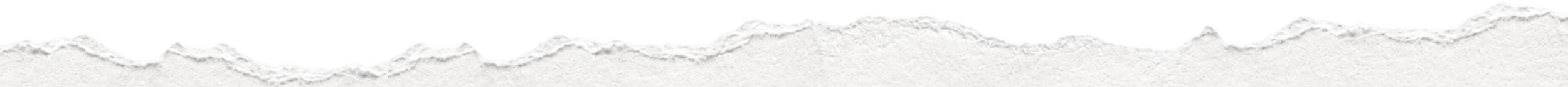 Close-up of torn white paper edges.