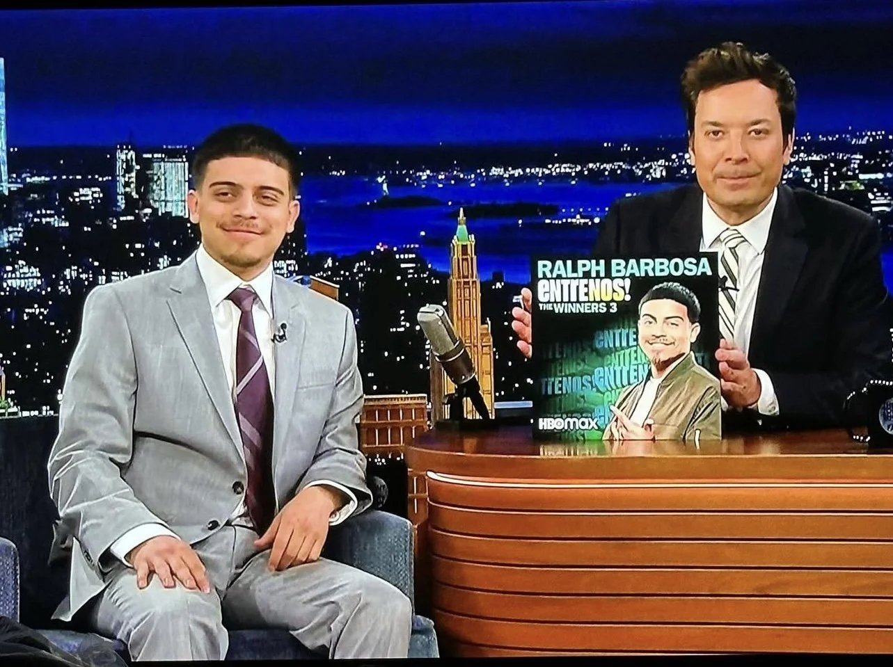 Ralph Barbosa and Jimmy Fallon tonight show debut holding the artwork for Entre Nos the winner 3